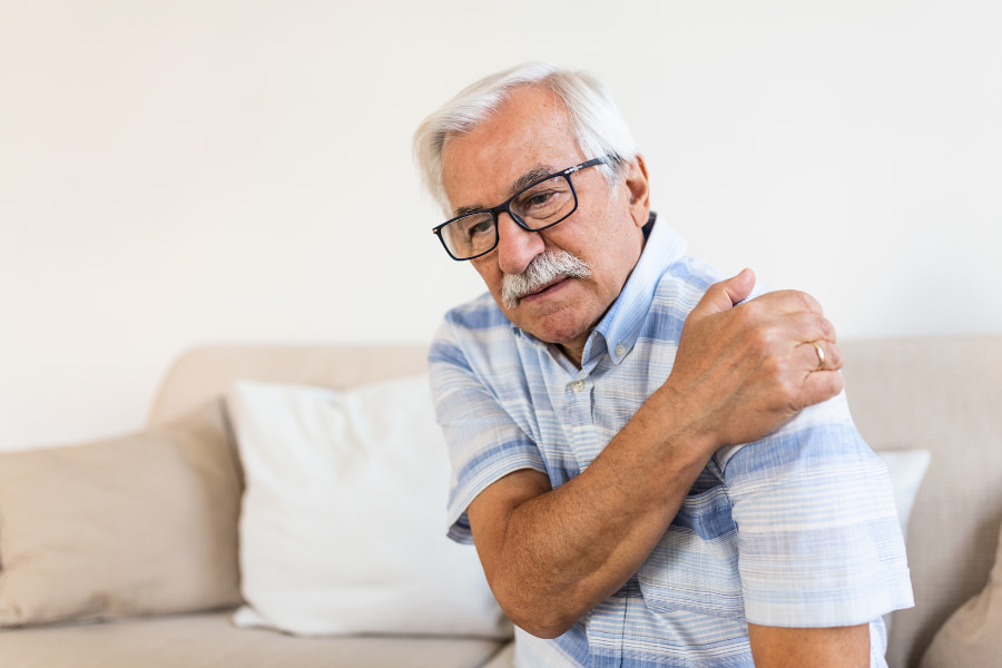 senior man experiencing shoulder pain