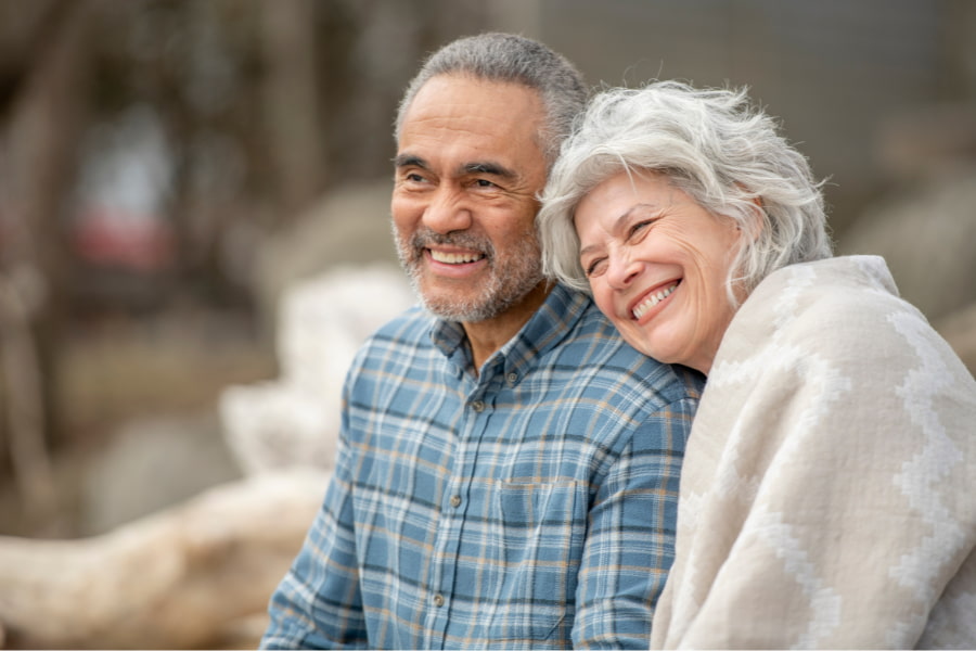 image of a senior couple looking out onto the ocean